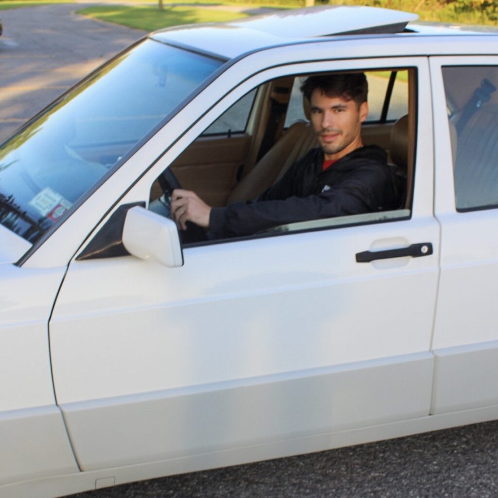 Author Jacob Stobnicki in Mercedes 190E 2.3